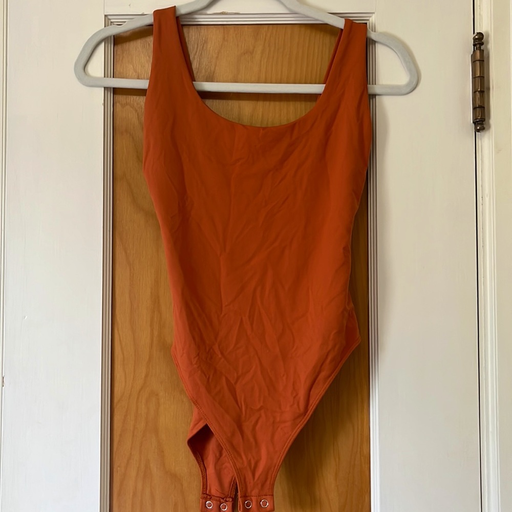 Forever 21 Lowback orange bodysuit. Women’s S. Double lined!